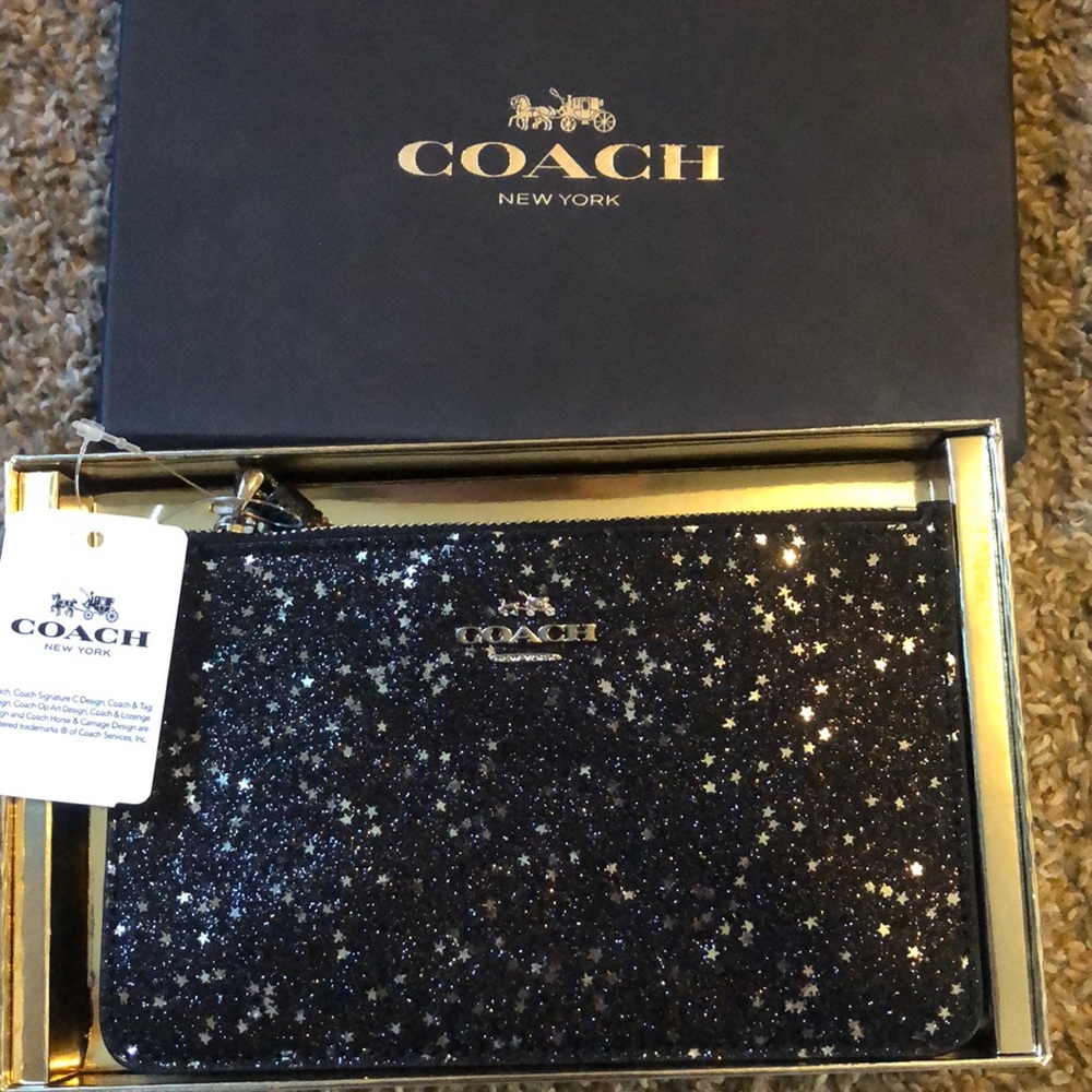 Coach. Black sparkling stars. Wristlet.